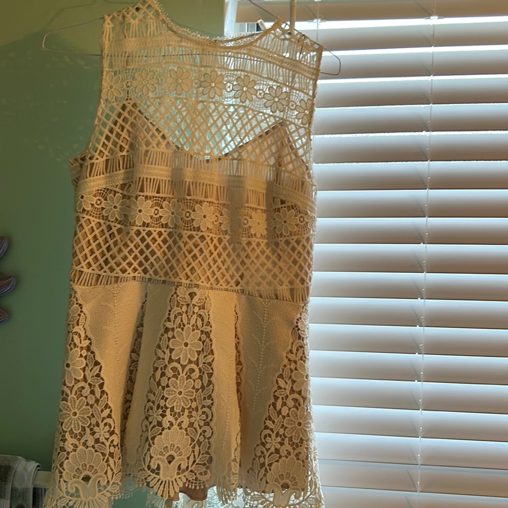 Ellie Tahari designer elegant dress halter top. Fabric is a durable eyelet.